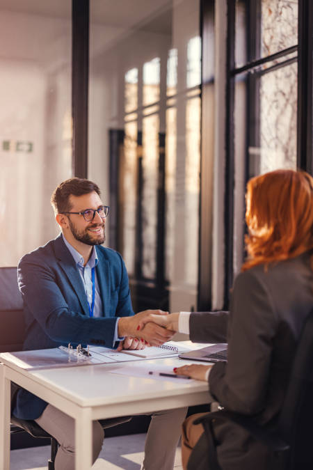 man and woman at table for a meeting